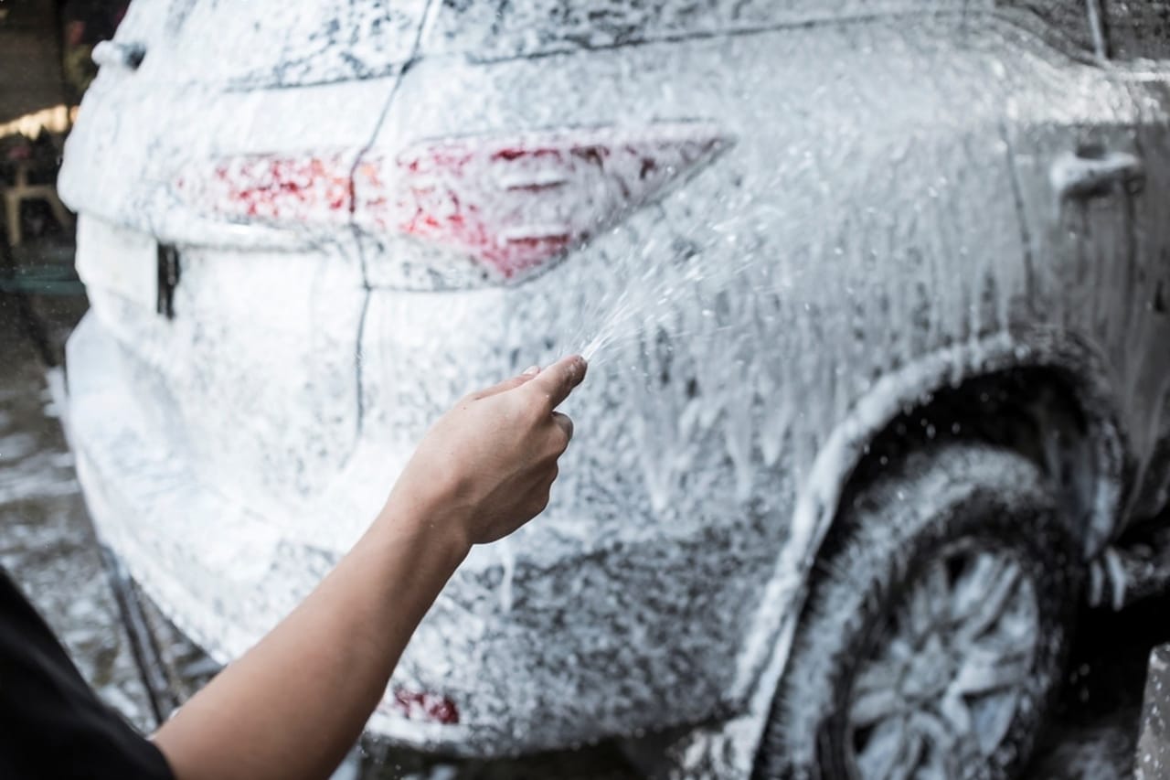 SUV being hand washed during an exterior detail at OG Detailing in Huntley, IL